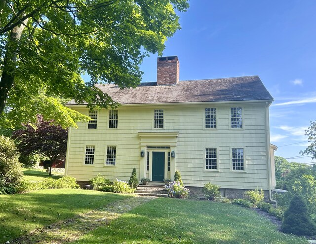 579 Taugwonk Rd, Stonington, CT 06378 - view of front of property featuring a chimney and a front lawn