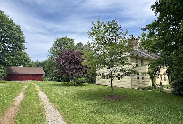 579 Taugwonk Rd, Stonington, CT 06378 - view of grassy yard featuring driveway, a barn, and an outdoor structure