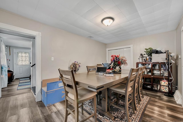 dining area featuring wood finished floors and visible vents