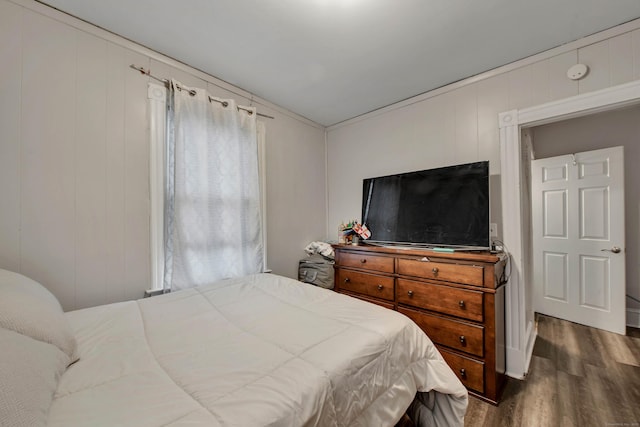 bedroom featuring dark wood finished floors