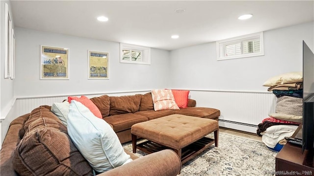 living room with recessed lighting, wainscoting, baseboard heating, and wood finished floors