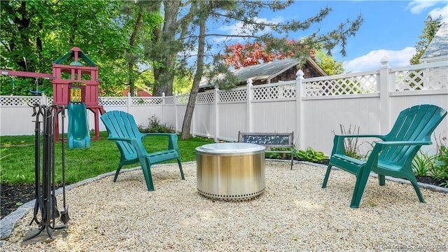 view of patio / terrace featuring a playground and a fenced backyard