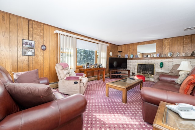 living room featuring a baseboard heating unit, wooden walls, visible vents, and a fireplace