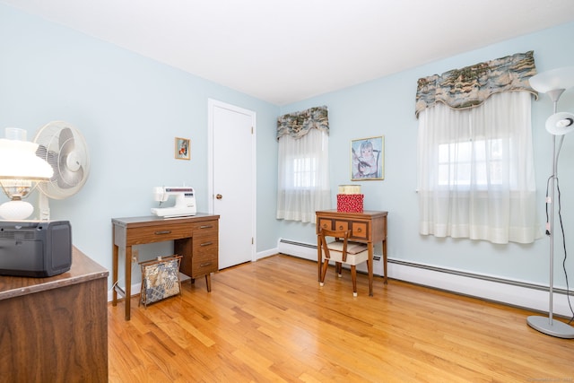 interior space featuring light wood finished floors and baseboards