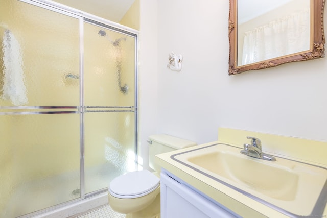 full bath featuring vanity, toilet, and a stall shower