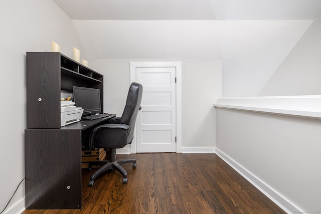 office space featuring baseboards, vaulted ceiling, and wood finished floors