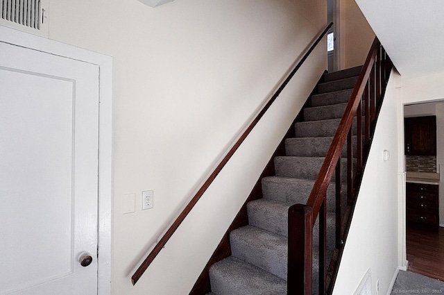 stairs featuring visible vents