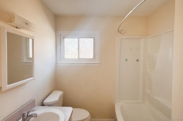 bathroom with shower / tub combination, vanity, and toilet