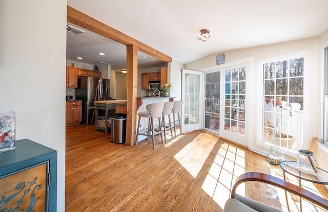 dining area featuring recessed lighting, visible vents, and light wood-style floors