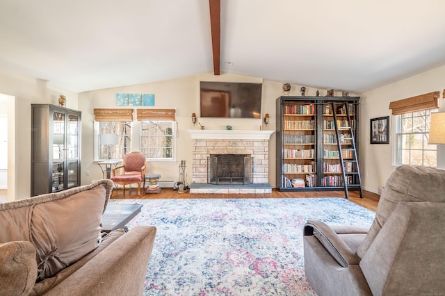 living room with lofted ceiling with beams, baseboards, wood finished floors, and a fireplace