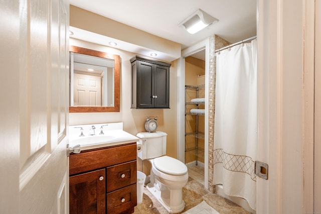 full bath featuring vanity, tile patterned floors, and toilet