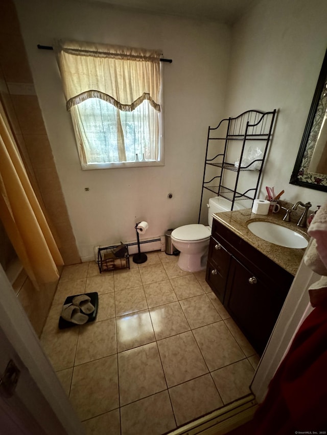 bathroom featuring toilet, vanity, and tile patterned floors