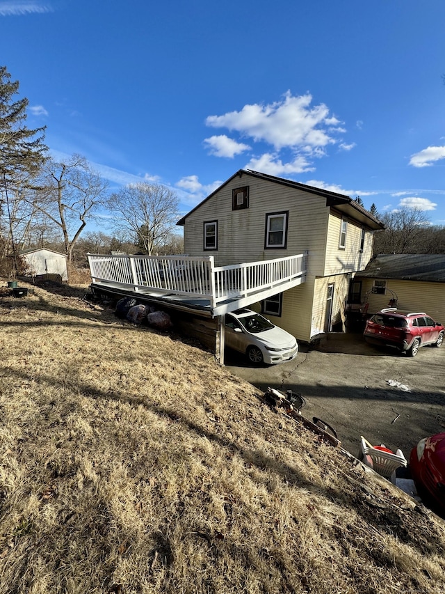 view of front of home with a wooden deck