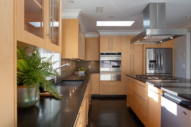 9 Schiller Rd, Fairfield, CT 06825 - kitchen with visible vents, island exhaust hood, a sink, stainless steel appliances, and a skylight