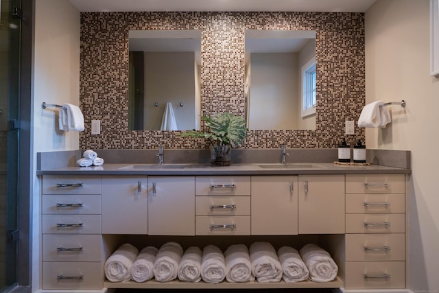 9 Schiller Rd, Fairfield, CT 06825 - bathroom featuring double vanity, backsplash, and a sink