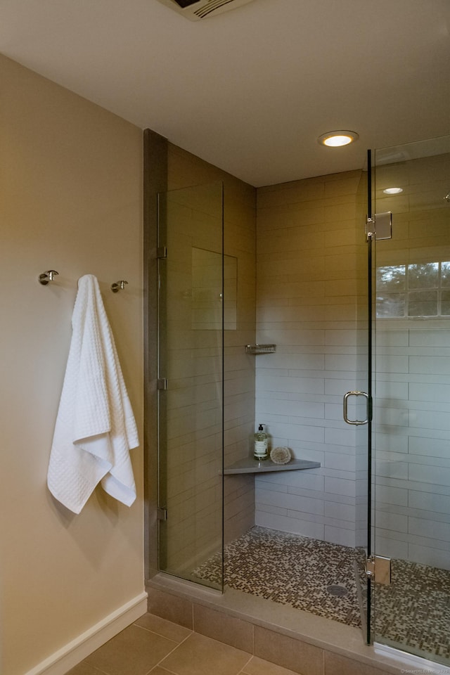 9 Schiller Rd, Fairfield, CT 06825 - bathroom with tile patterned floors, a shower stall, and baseboards
