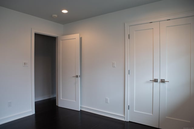 9 Schiller Rd, Fairfield, CT 06825 - unfurnished bedroom featuring recessed lighting, baseboards, dark wood-style flooring, and a closet