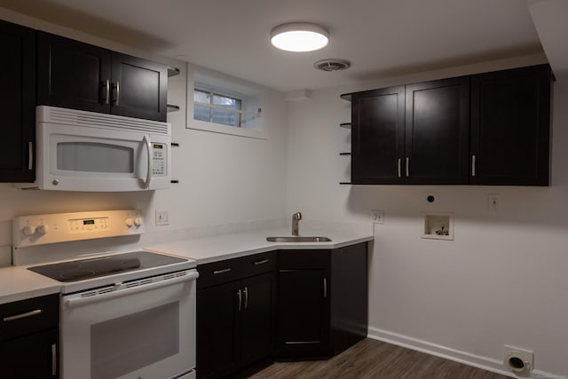 9 Schiller Rd, Fairfield, CT 06825 - kitchen with a sink, visible vents, white appliances, and dark cabinetry