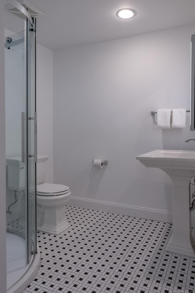 9 Schiller Rd, Fairfield, CT 06825 - bathroom featuring tile patterned flooring, a shower stall, toilet, and baseboards