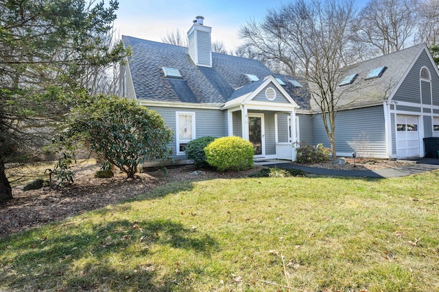 view of front facade featuring a front yard, roof with shingles, and a chimney