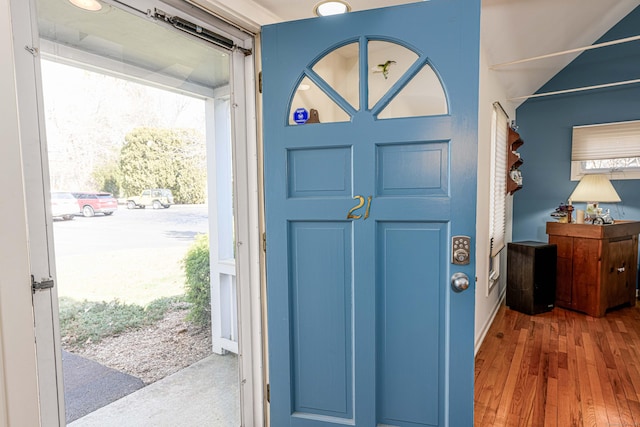 entryway with wood finished floors