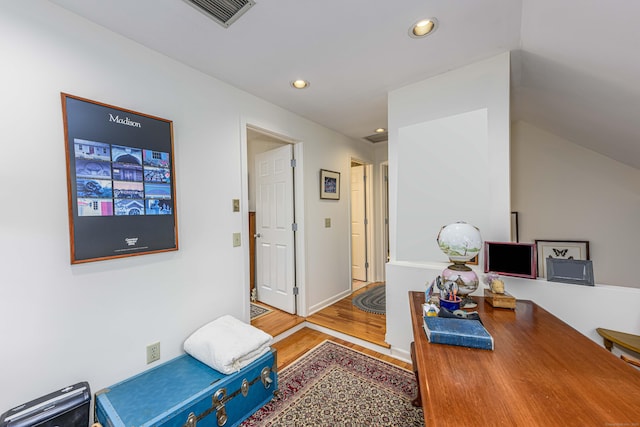 home office featuring recessed lighting, visible vents, baseboards, and wood finished floors