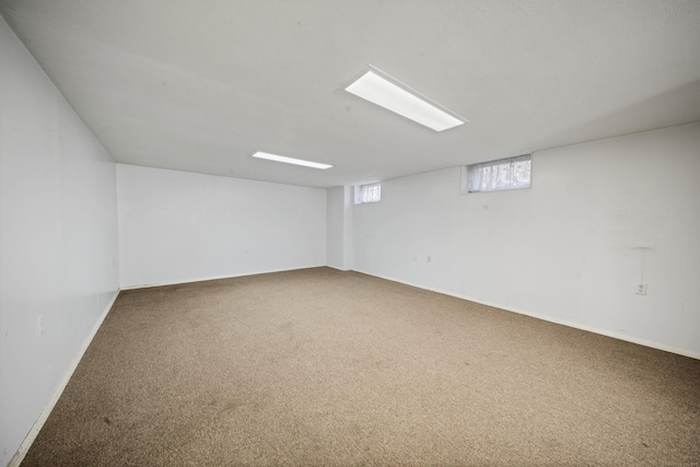 interior space featuring baseboards and carpet flooring