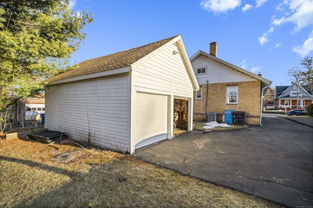 view of side of home featuring an outdoor structure