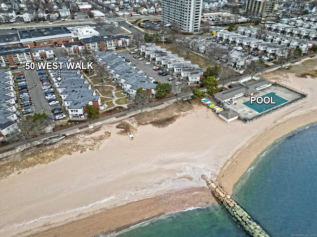 birds eye view of property with a water view and a view of city