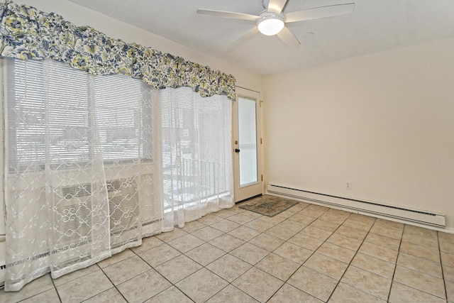 unfurnished room featuring light tile patterned floors, ceiling fan, and a baseboard radiator