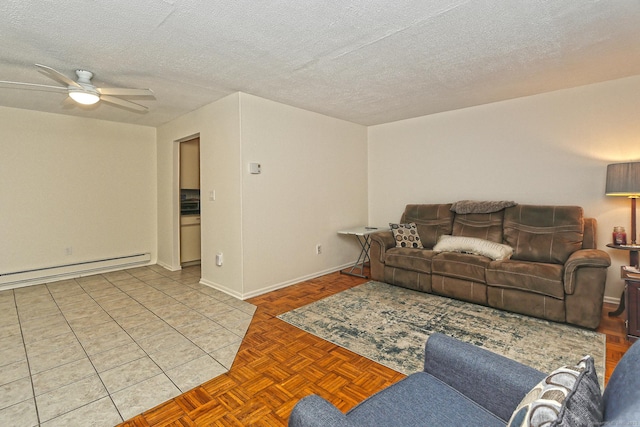 living area featuring ceiling fan, a baseboard heating unit, and a textured ceiling