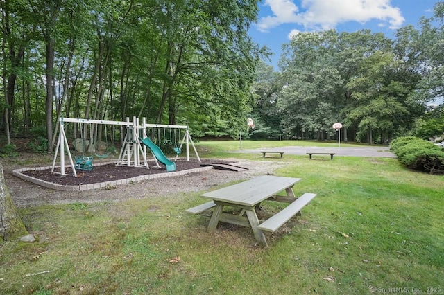 community playground featuring a yard and community basketball court