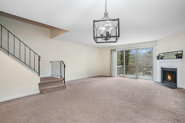 unfurnished living room with a chandelier, carpet floors, a fireplace with flush hearth, baseboards, and stairs