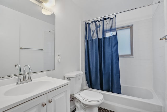 bathroom with toilet, shower / tub combo, and vanity