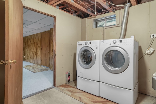 clothes washing area featuring washing machine and dryer and laundry area