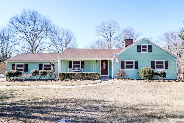 view of front of property featuring covered porch and a chimney