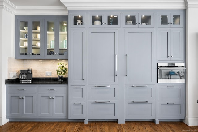 31 Birch Hill Rd, Lyme, CT 06371 - bar featuring stainless steel oven, backsplash, crown molding, and dark wood finished floors