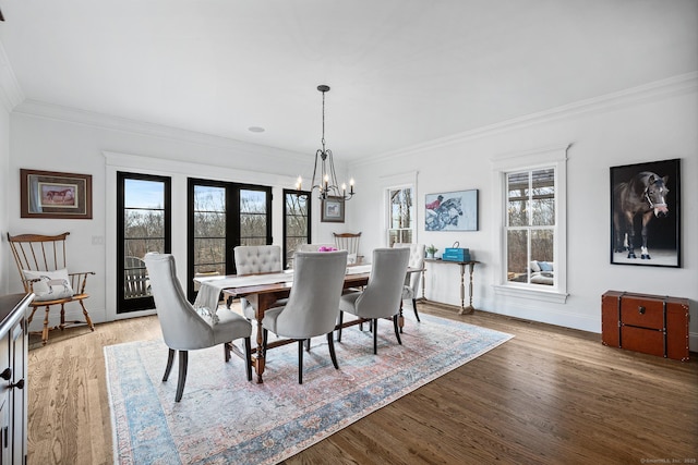 31 Birch Hill Rd, Lyme, CT 06371 - dining area with plenty of natural light, ornamental molding, a chandelier, wood finished floors, and baseboards