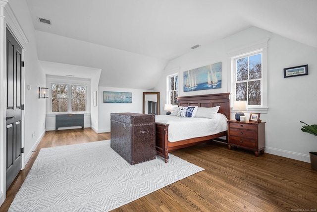 31 Birch Hill Rd, Lyme, CT 06371 - bedroom with vaulted ceiling, wood finished floors, baseboards, and multiple windows