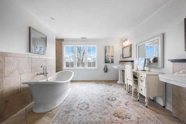 31 Birch Hill Rd, Lyme, CT 06371 - bathroom featuring ornamental molding, tile walls, and a soaking tub
