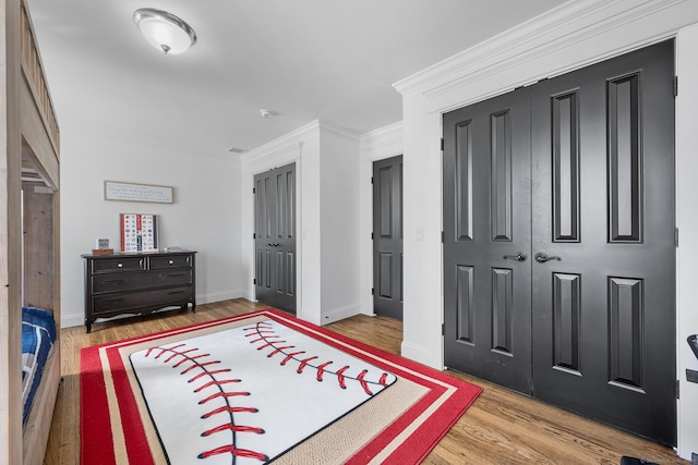 31 Birch Hill Rd, Lyme, CT 06371 - bedroom with wood finished floors, a closet, and baseboards
