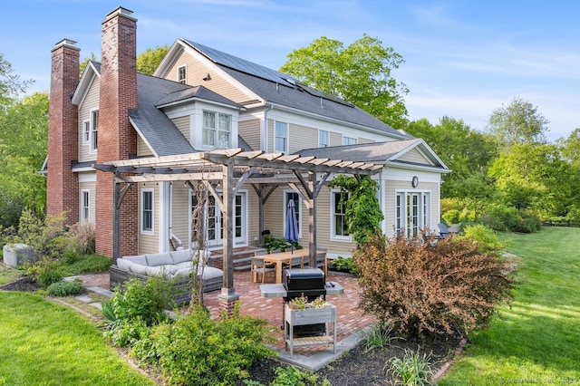 31 Birch Hill Rd, Lyme, CT 06371 - view of front facade with a pergola, an outdoor hangout area, a chimney, a patio, and french doors