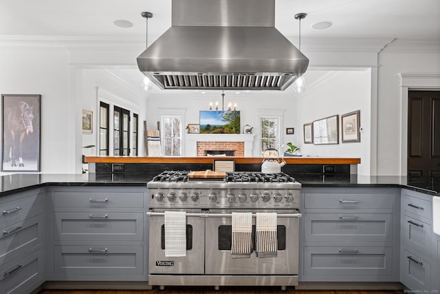 31 Birch Hill Rd, Lyme, CT 06371 - kitchen with gray cabinets, range with two ovens, island range hood, crown molding, and pendant lighting