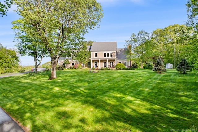 31 Birch Hill Rd, Lyme, CT 06371 - view of front of house with a front lawn, a storage shed, an outdoor structure, and a porch