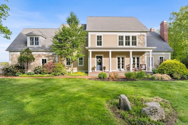 31 Birch Hill Rd, Lyme, CT 06371 - rear view of property with a yard, a chimney, french doors, and a porch