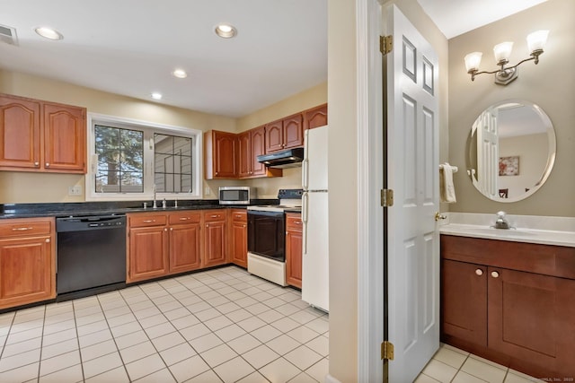 kitchen with electric range, a sink, under cabinet range hood, dishwasher, and stainless steel microwave