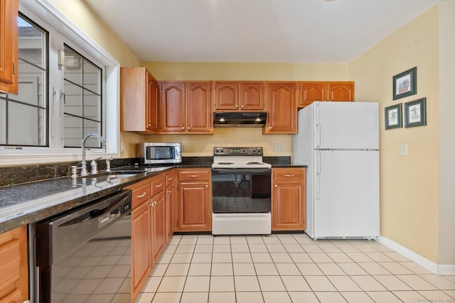 kitchen with freestanding refrigerator, black dishwasher, under cabinet range hood, range with electric stovetop, and stainless steel microwave