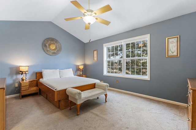 bedroom with baseboards, a ceiling fan, lofted ceiling, and carpet floors