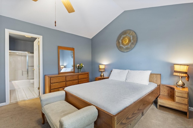 bedroom with ceiling fan, lofted ceiling, carpet floors, and connected bathroom