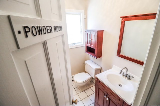 bathroom with tile patterned flooring, vanity, and toilet